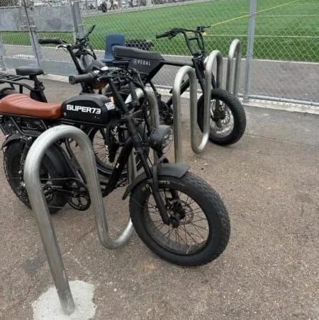 Ebikes locked to a bike rack